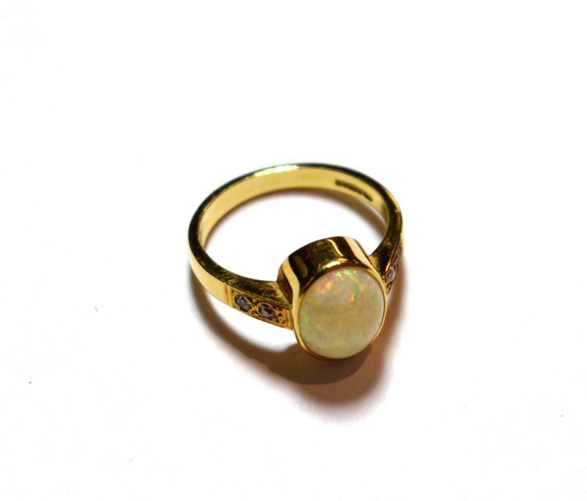 Lot 5 - An 18 carat gold opal ring, finger size Q