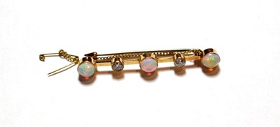 Lot 8 - An opal and diamond bar brooch, three oval cabochon opals alternate with two old cut diamonds...