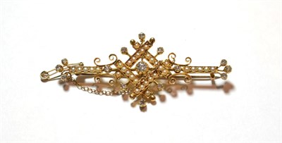 Lot 17 - An Edwardian split pearl and diamond brooch, the central old cut diamond in a yellow collet...