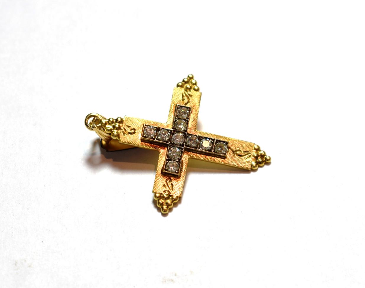 Lot 19 - A diamond cross pendant, the cross motif set throughout with round brilliant cut diamonds in...