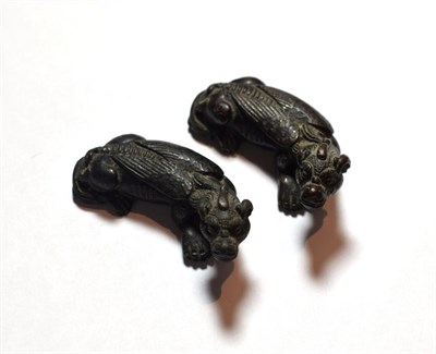 Lot 21 - Two Chinese scroll bronze weights