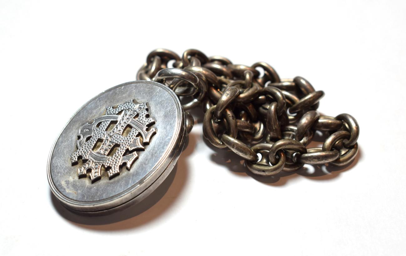 Lot 33 - A Victorian locket on chain, locket measures 6.2cm by 4.0cm, chain length 46.5cm