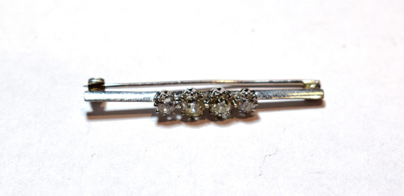 Lot 39 - An old cut diamond four stone bar brooch, stamped '18CT', total estimated diamond weight 1.40 carat