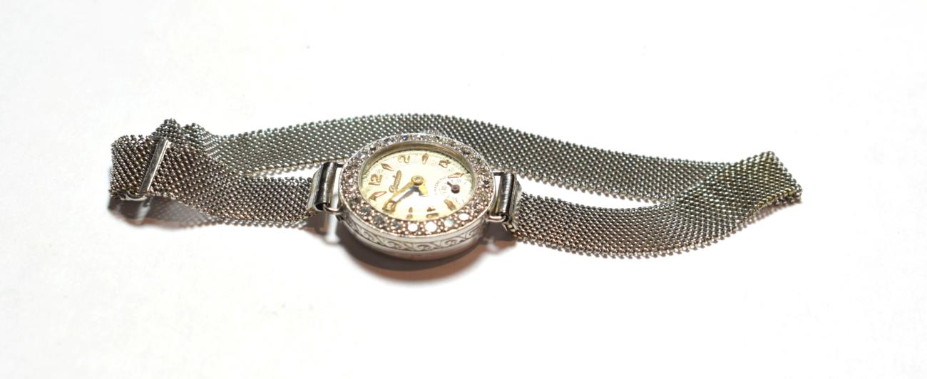 Lot 41 - A lady's 18 carat white gold diamond set wristwatch, dial signed Premier, mesh finished white metal