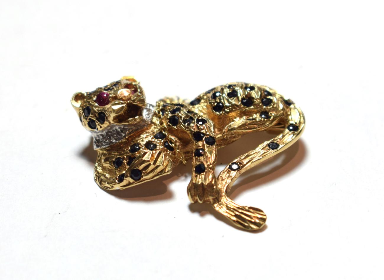 Lot 44 - A 9 carat gold gem set brooch in the form of a leopard, length 3.7cm