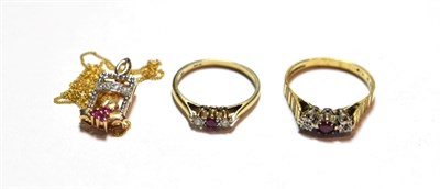 Lot 50 - An 18 carat gold ruby and diamond three stone ring, finger size R; a 9 carat gold ruby and...