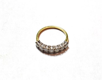 Lot 57 - A diamond seven stone ring, finger size M
