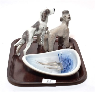 Lot 82 - A Copenhagen Poodle, a Setter, and a dish painted with a ship (3)