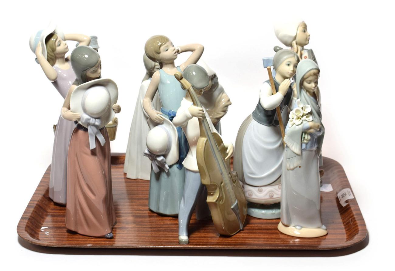 Lot 86 - Lladro figures of women and girls, and a boy playing a double bass (10)