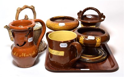Lot 89 - A selection of 19th century slip ware including: frog loving cup inscribed 'Sup it Off' and a...