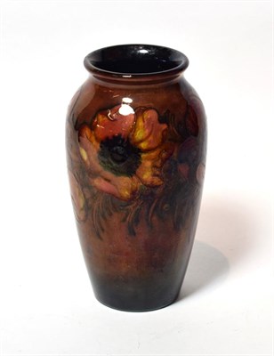 Lot 91 - A Walter Moorcroft flambé Anemone design vase, impressed factory marks and POTTER TO H.M. THE...