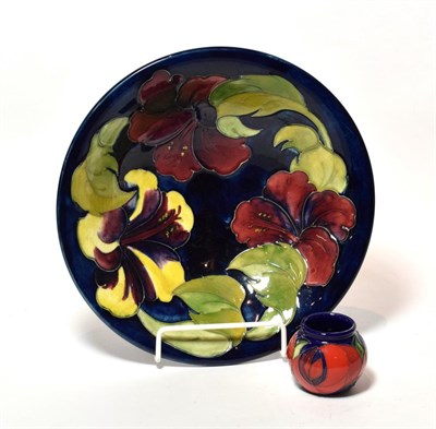 Lot 93 - A modern Moorcroft Hibiscus bowl, together with a small Moorcroft Poppy pot (2)