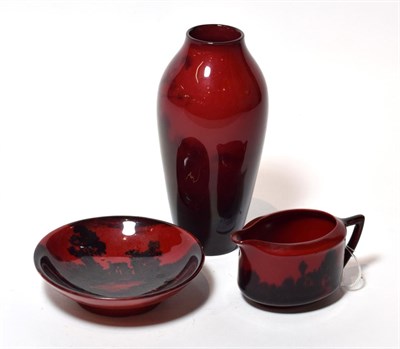 Lot 94 - A Royal Doulton Flambe vase, together with a further flambe jug and bowl (3)