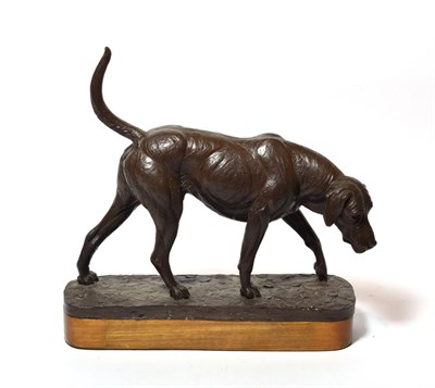Lot 98 - A bronzed resin model of a hound, signed Doris Lindner, raised on an oak base, 24cm high