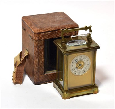 Lot 103 - A brass carriage timepiece with travelling outer case