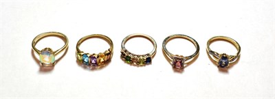 Lot 139 - Five assorted 9 carat gold gem set rings, including a solitaire example, a cluster example etc,...
