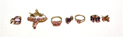 Lot 145 - Two 9 carat gold amethyst pendants; a pair of amethyst earrings, stamped '10K'; and a gem set suite
