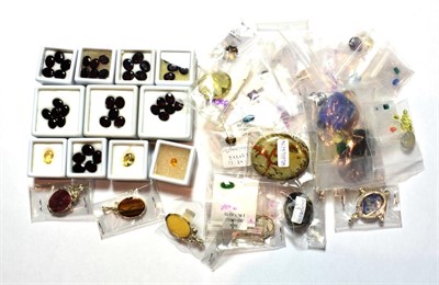 Lot 154 - A quantity of loose gemstones including garnet, citrine, blue topaz, amethyst, tourmaline,...