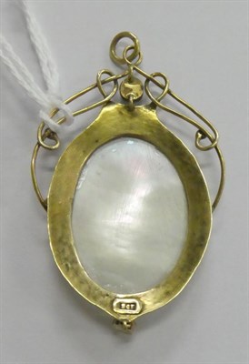 Lot 169 - An Arts & Crafts style mother of pearl and turquoise pendant, stamped '9CT'