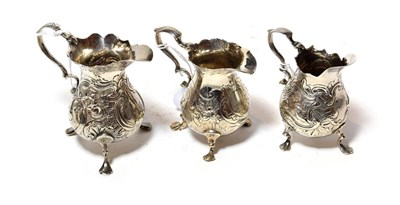 Lot 194 - Three George II silver cream-jug, maker's marks indistinct, London, one 1741, two circa 1750,...