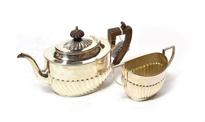 Lot 200 - A Victorian silver teapot and a similar sugar-bowl, the teapot maker's mark HH, possibly for...