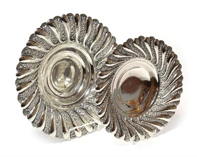 Lot 216 - Two graduated Egyptian silver bowls, first half 20th century, each spiral-fluted circular and...