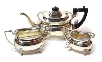 Lot 218 - A three-piece George V silver tea-service, by Cooper Brothers and Sons Ltd., Sheffield, 1927,...