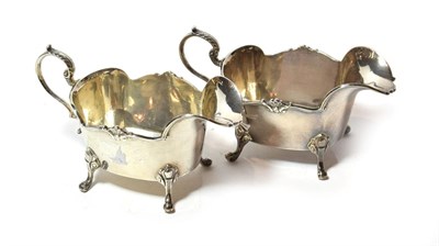 Lot 223 - A pair of George V silver sauceboats, by Manoah Rhodes & Sons Ltd., London, 1929, each oblong...