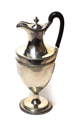 Lot 224 - A George III silver hot-water jug, by John Scofield, London, 1787, vase shaped and with beaded...