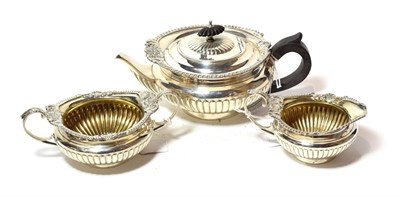 Lot 235 - A three-piece Victorian silver tea-service, by Walter and John Barnard, London, 1891 and 1892, each