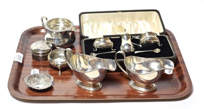 Lot 253 - A collection of silver, comprising: a pair of George V silver sauceboats, by Synyer & Beddoes,...