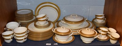 Lot 270 - A Royal Worcester gold coloured embossed dinner service, pattern number 1393