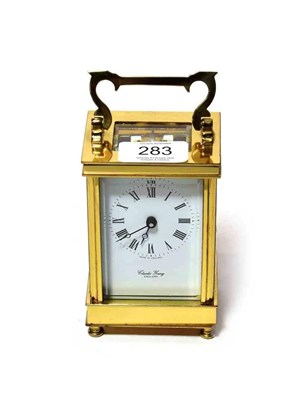 Lot 283 - A brass carriage timepiece, dial signed Charles Young England, 20th century