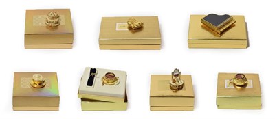 Lot 297 - Five assorted Estée Lauder solid perfume compacts, comprising 'Beautiful Party Cake', 'Tea...