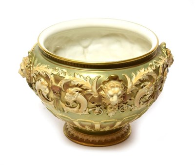 Lot 301 - A rare Royal Worcester footed bowl, blush ivory and decorated with lion masks, shape number...