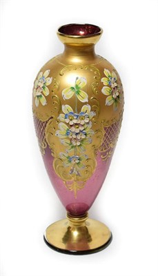 Lot 304 - A 19th century Bohemian style pink glass vase with gilt overlay and floral decoration