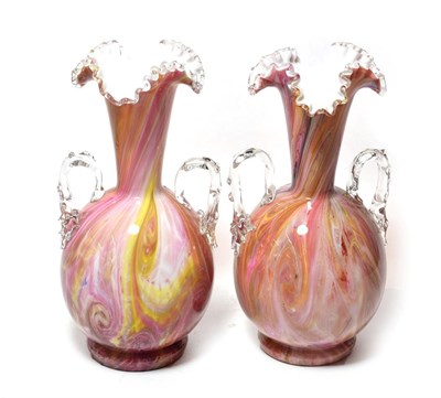 Lot 306 - A pair of twin-handled pink marbled glass vases