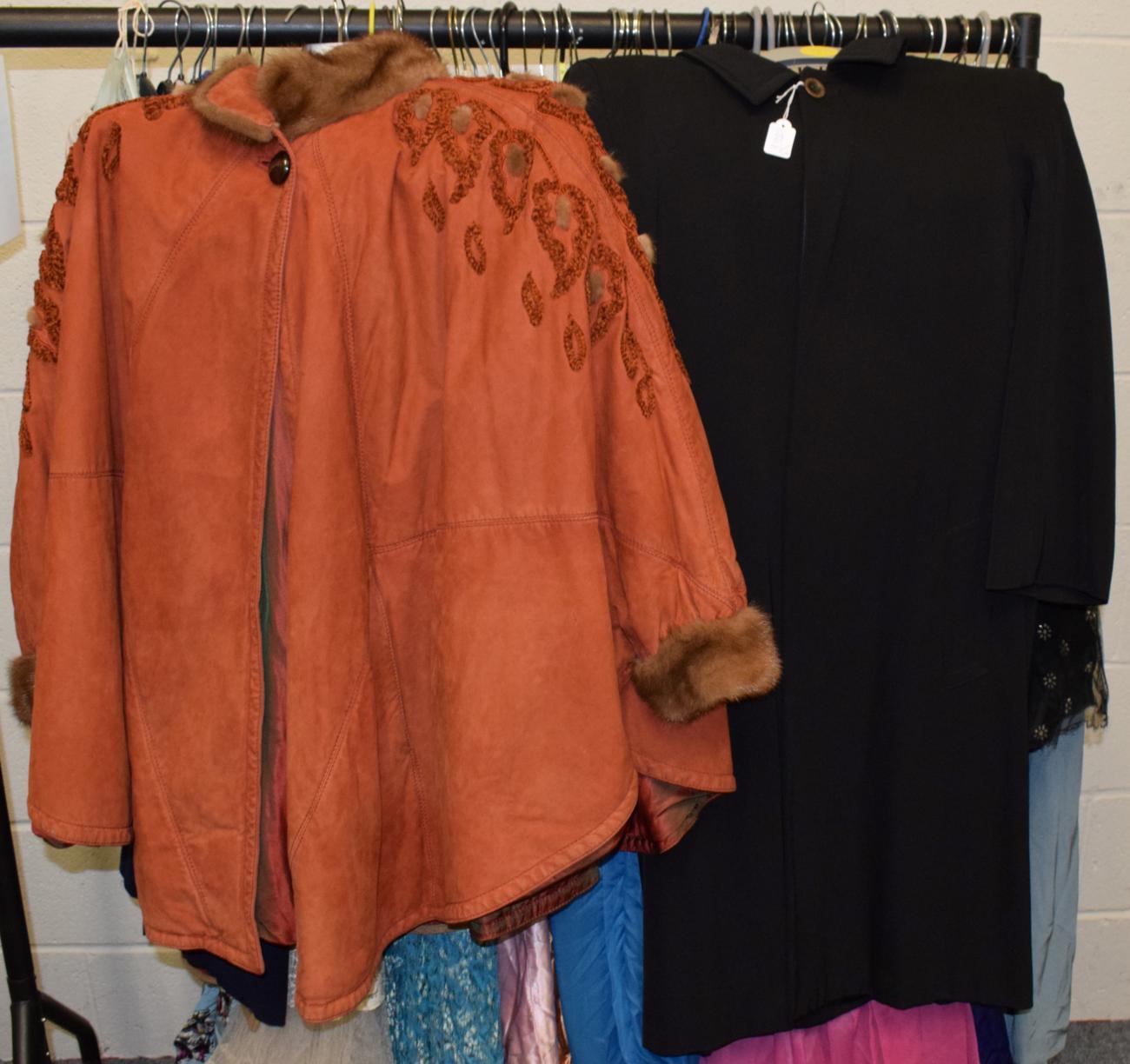 Lot 1012 - Modern Raff rust coloured poncho, of panelled design with mink trims to the collar and cuffs...