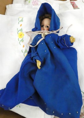 Lot 1050 - A late 19th century wax shoulder head doll with blue eyes and wig, on fabric body with papier mache