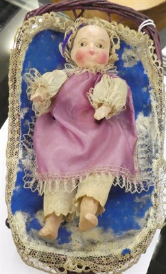 Lot 1055 - 19th century Automata baby doll, with painted papier mache head and lower limbs, inserted eyes,...