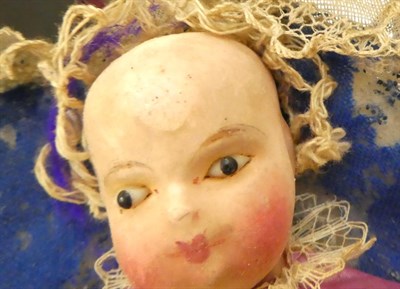 Lot 1055 - 19th century Automata baby doll, with painted papier mache head and lower limbs, inserted eyes,...
