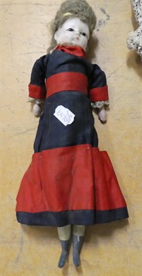 Lot 1056 - 19th century wax shoulder head doll, with inserted eyes, brown wig, in a contemporary printed...