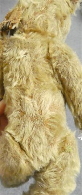 Lot 1060 - Circa 1920s jointed teddy bear, in light brown mohair with boot button eyes, stitched nose and...