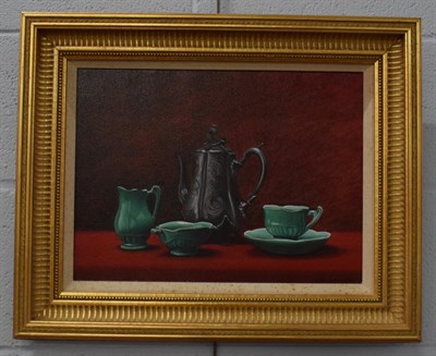 Lot 1128 - Ray Greenfield (Contemporary), Still life of teapot, cup and saucer, cream jug and sugar bowl,...