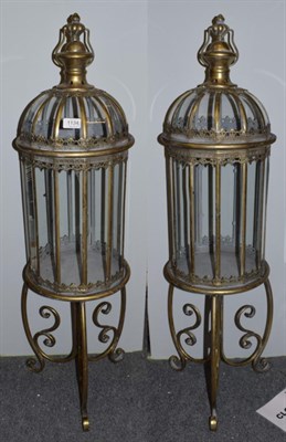 Lot 1134 - A pair of reproduction lanterns on stands