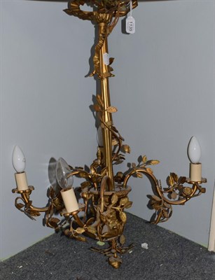 Lot 1135 - A late 19th century gilt metal four branch chandelier with rose leaf decoration