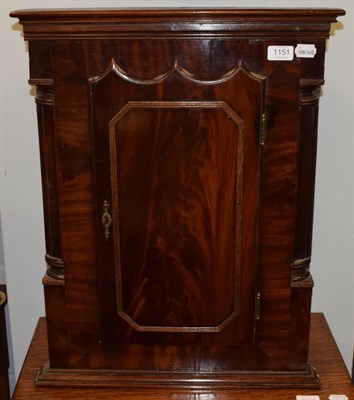 Lot 1151 - A mid 19th century, George IIIl mahogany corner cupboard, the moulded frieze over a shaped...