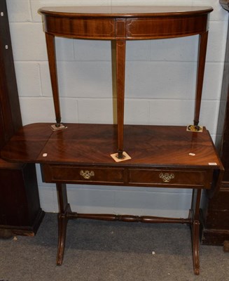 Lot 1155 - A William IV style sofa table, raised on outswept and channeled legs, united by a turned stretcher
