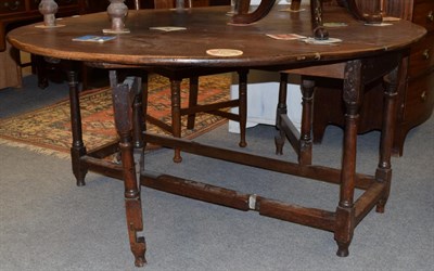Lot 1174 - An 18th century oak gateleg table