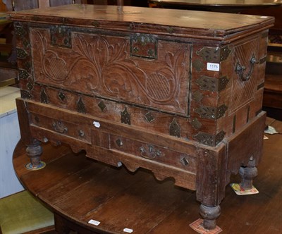 Lot 1176 - A brass mounted carved teak blanket box on stand, fitted with two drawers, 66cm by 93cm by 40cm